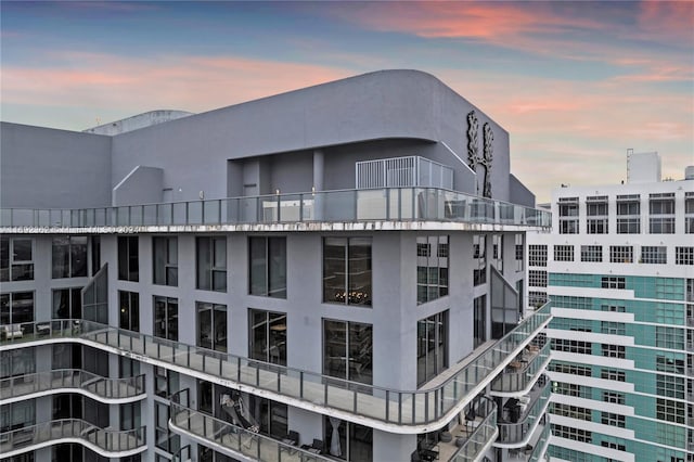 view of outdoor building at dusk