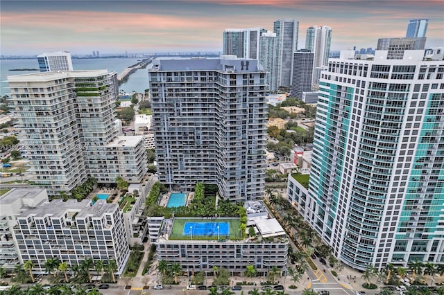 121 NE 34th St Unit Ph3217, Miami, FL 33137 - aerial view at dusk of view of pool, a water view, and a view of city