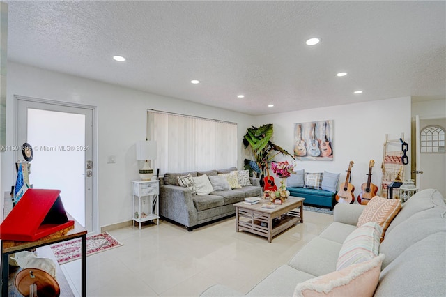 living room with a textured ceiling