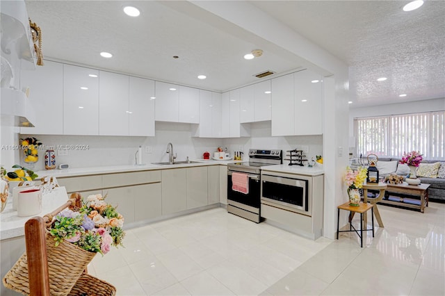 kitchen featuring white cabinetry, appliances with stainless steel finishes, and a textured ceiling