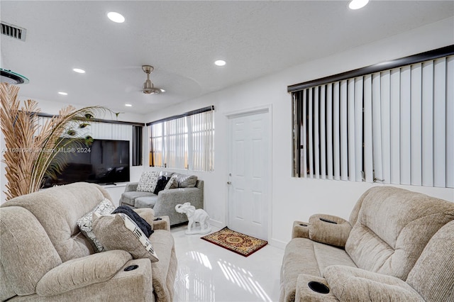 living room with a textured ceiling