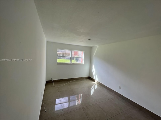 view of tiled spare room