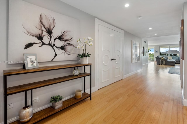 corridor featuring light hardwood / wood-style floors