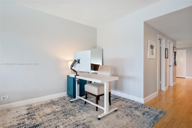 office with light hardwood / wood-style floors