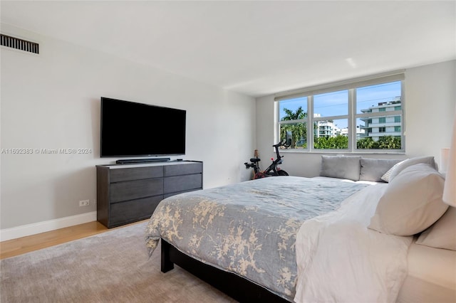 bedroom with light hardwood / wood-style floors