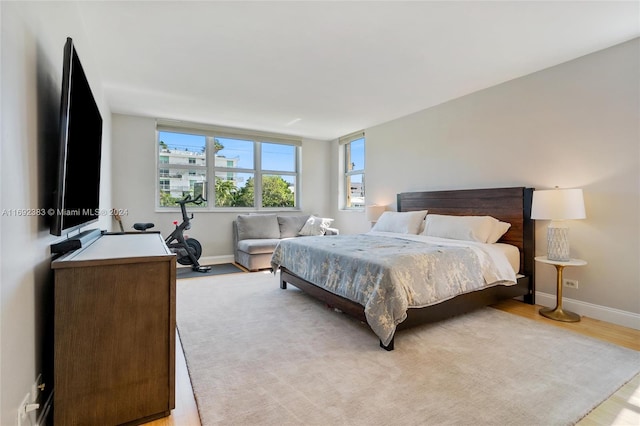 bedroom with light hardwood / wood-style floors