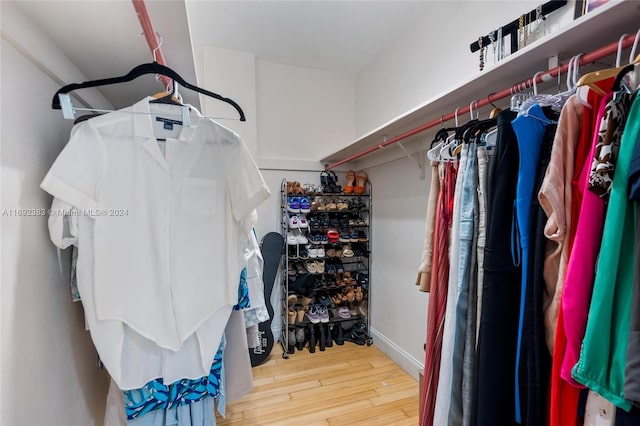 walk in closet featuring hardwood / wood-style flooring