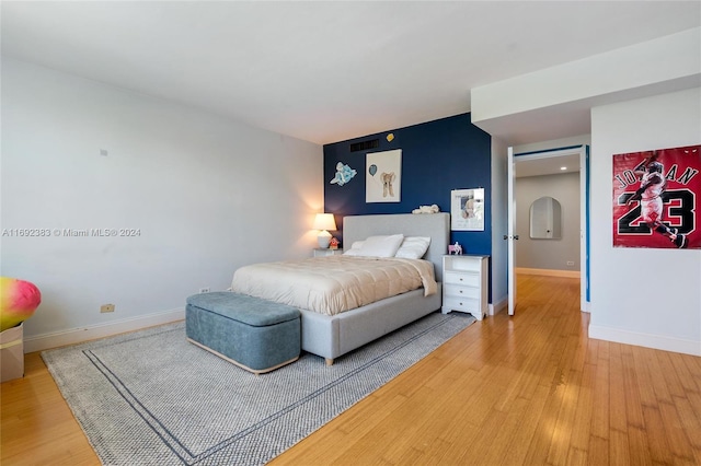 bedroom featuring hardwood / wood-style floors