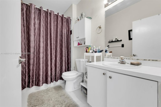 bathroom featuring vanity, tile patterned floors, toilet, and a shower with curtain