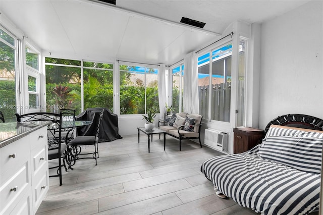 sunroom / solarium featuring a healthy amount of sunlight