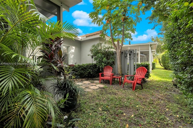 view of yard with a sunroom