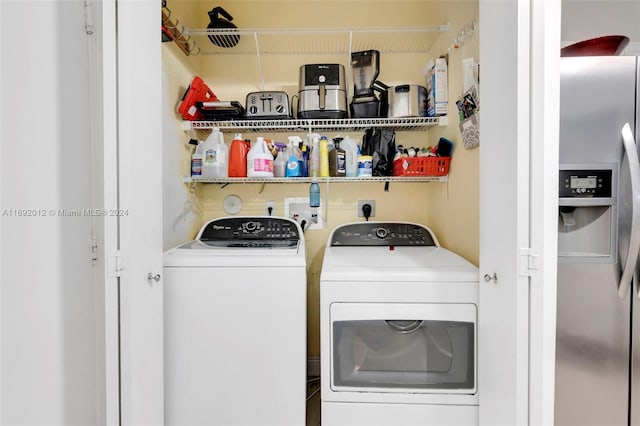 washroom featuring washing machine and dryer