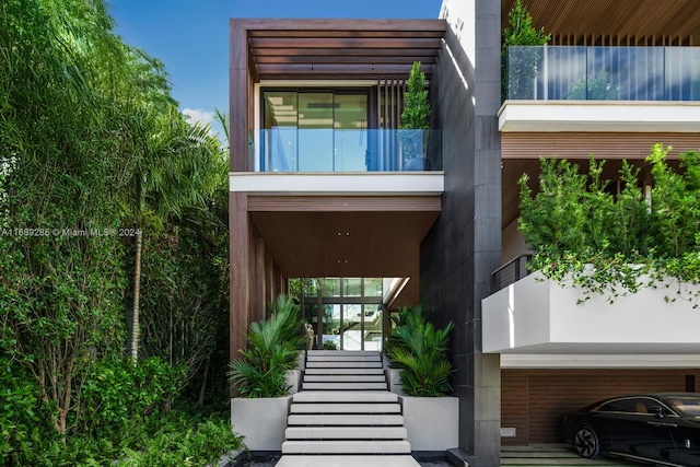 doorway to property featuring a balcony