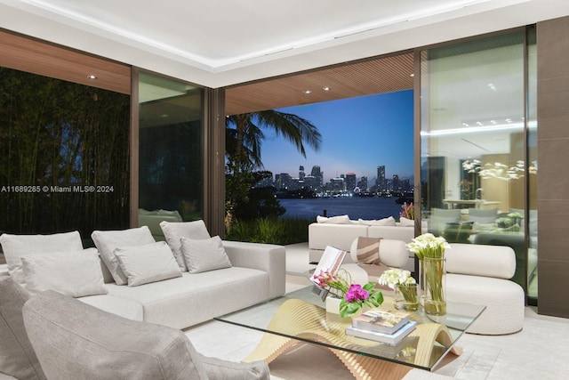 interior space with a water view and an outdoor living space