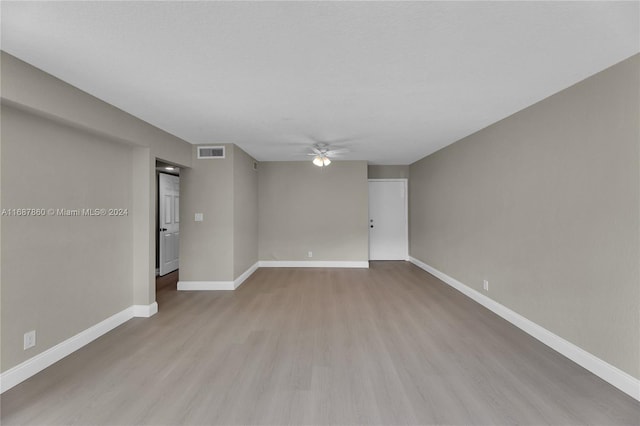 spare room with light hardwood / wood-style flooring and ceiling fan