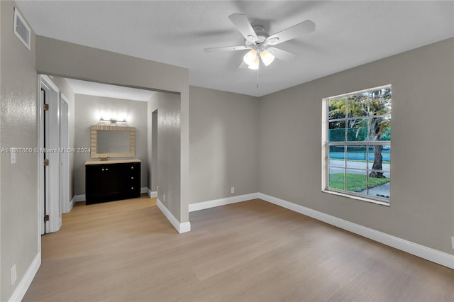 unfurnished bedroom featuring light hardwood / wood-style floors and ceiling fan