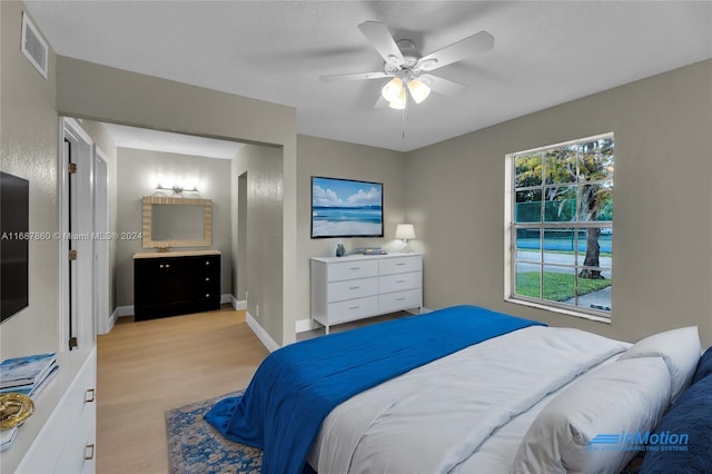 bedroom featuring ceiling fan and light hardwood / wood-style flooring