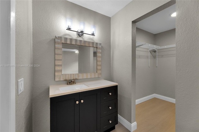 bathroom featuring hardwood / wood-style floors and vanity