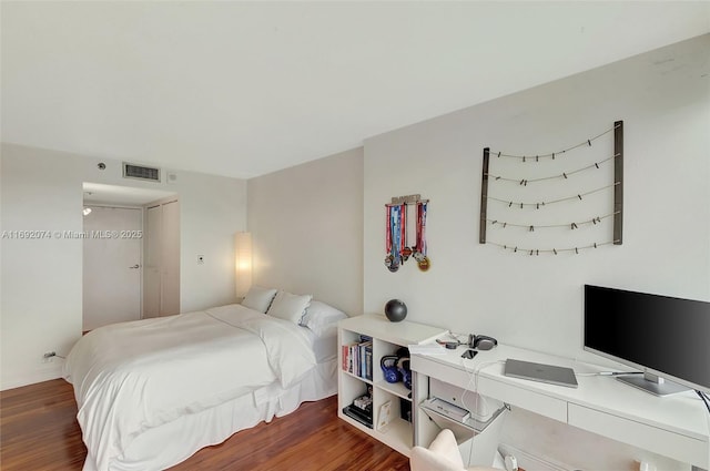 bedroom featuring dark wood-type flooring