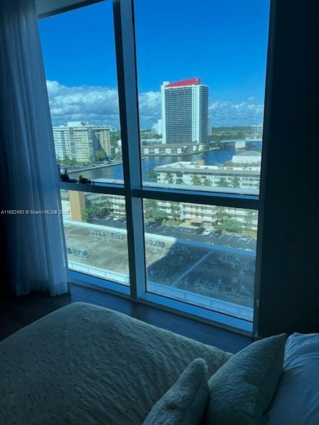 bedroom with a view of city