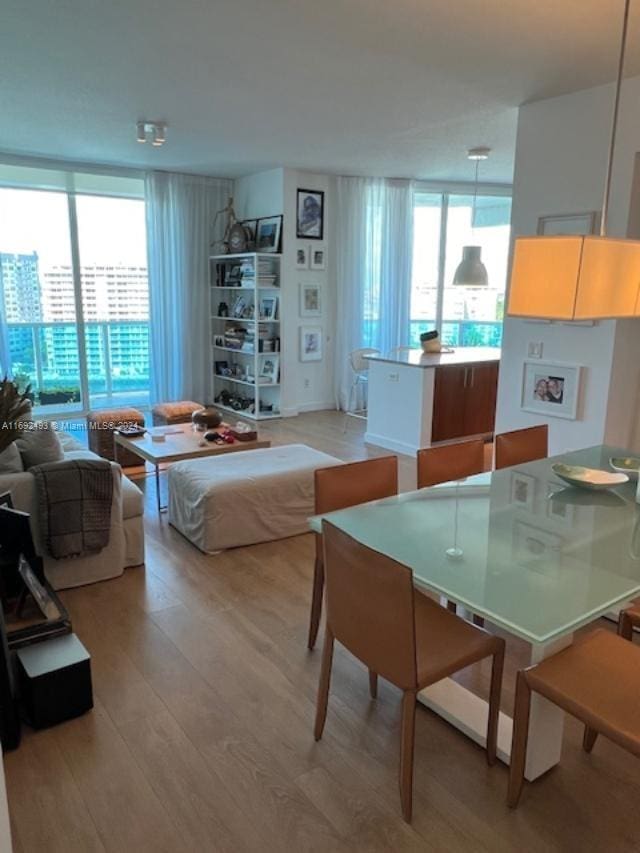 dining area featuring light wood-type flooring