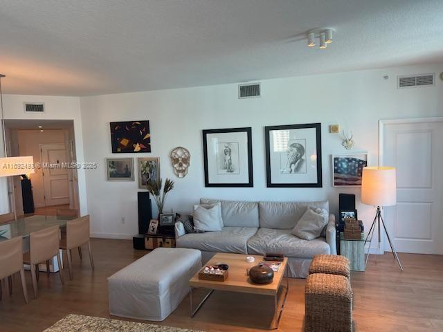 living room featuring dark hardwood / wood-style floors