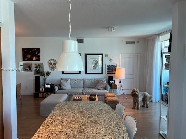 bedroom with dark hardwood / wood-style flooring