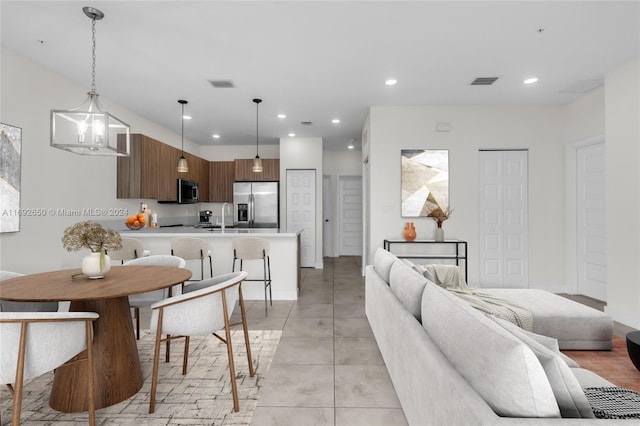 interior space featuring sink and a notable chandelier