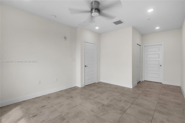 spare room with ceiling fan