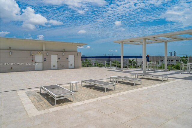 view of patio / terrace with a water view and a pergola