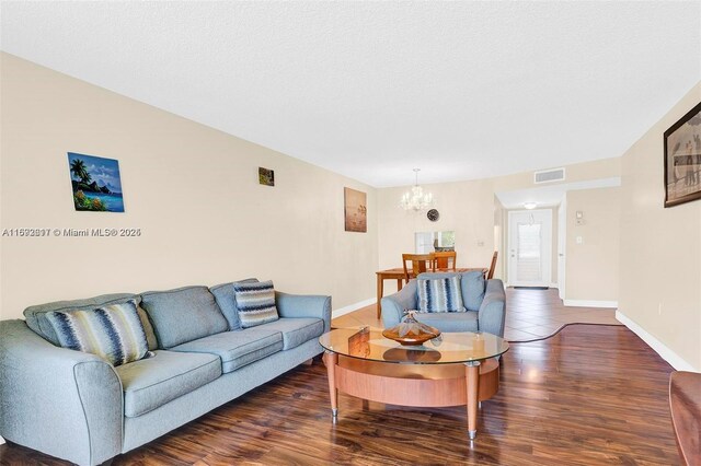 2951 E Sunrise Lakes Dr Unit 209, Sunrise, FL 33322 - living area with a chandelier, baseboards, and wood finished floors