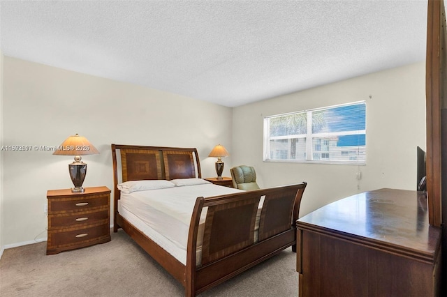 2951 E Sunrise Lakes Dr Unit 209, Sunrise, FL 33322 - bedroom featuring light colored carpet and a textured ceiling