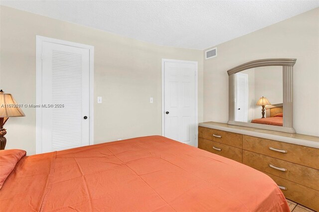2951 E Sunrise Lakes Dr Unit 209, Sunrise, FL 33322 - bedroom with a textured ceiling