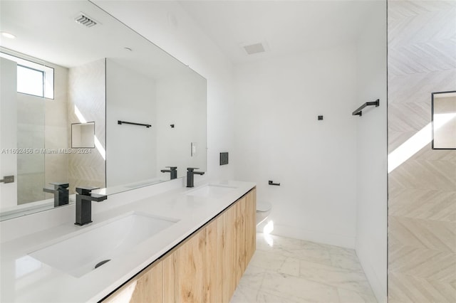 bathroom with toilet and vanity