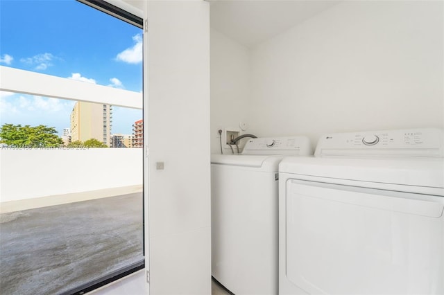 clothes washing area featuring washing machine and dryer