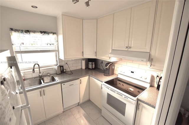 kitchen featuring white cabinetry, sink, white appliances, and decorative backsplash