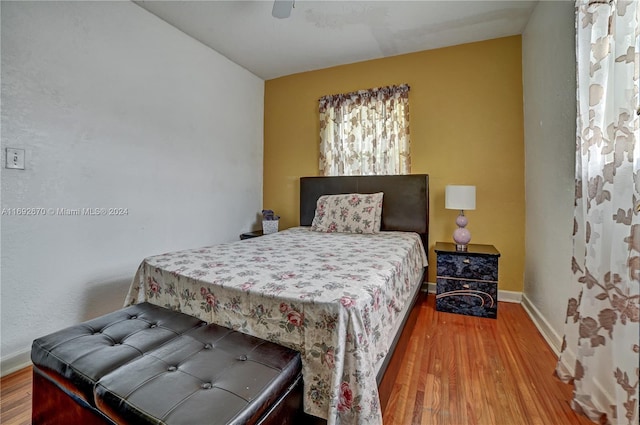 bedroom featuring hardwood / wood-style floors and ceiling fan