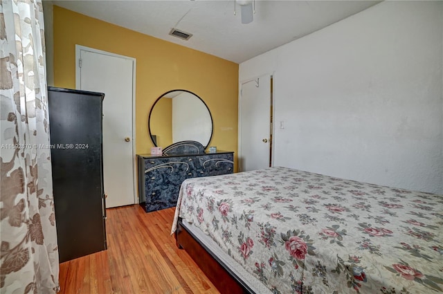 bedroom featuring ceiling fan and light hardwood / wood-style flooring