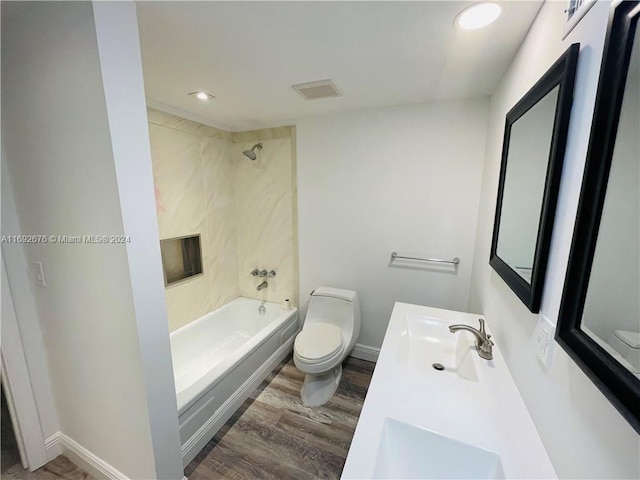 full bathroom featuring toilet, bathtub / shower combination, vanity, and wood-type flooring