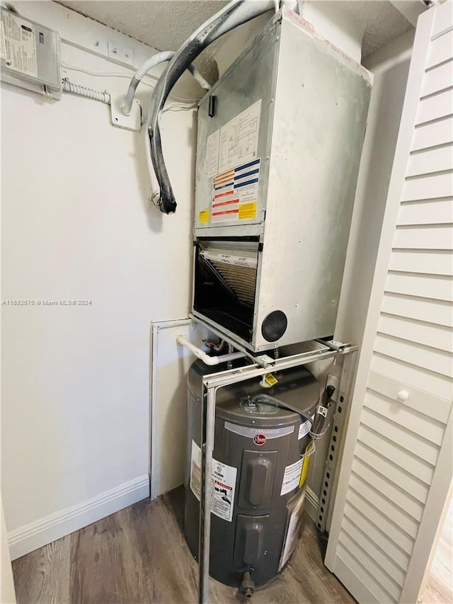 utility room featuring electric water heater