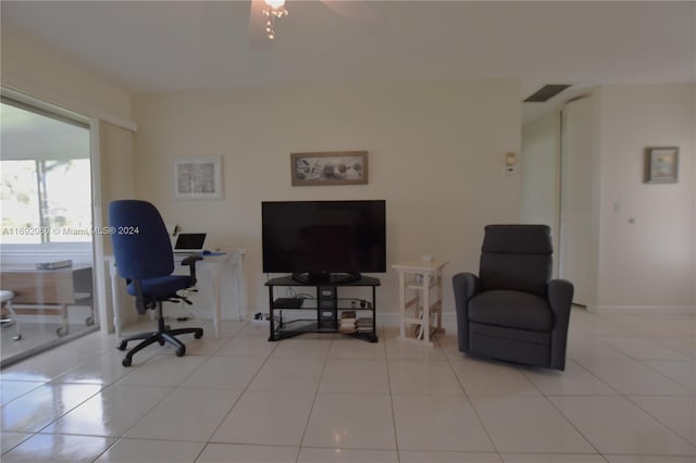 office with ceiling fan and light tile patterned floors