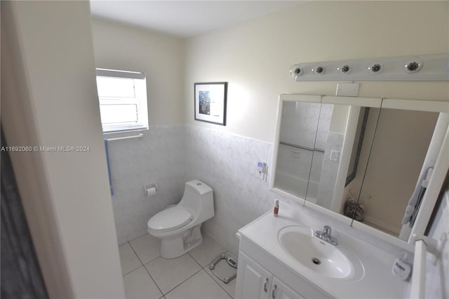 bathroom featuring tile walls, tile patterned flooring, vanity, and toilet