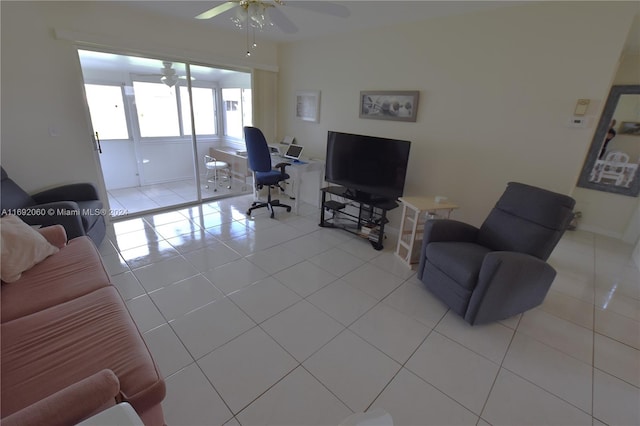 tiled living room with ceiling fan