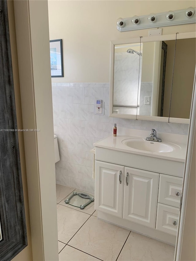 bathroom with tile walls and vanity