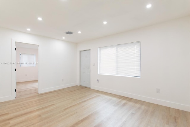 spare room featuring light hardwood / wood-style floors