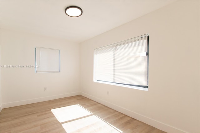 unfurnished room with light hardwood / wood-style floors