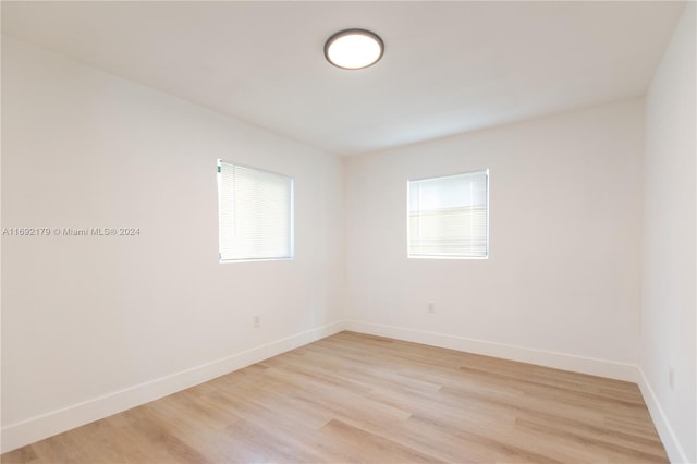 spare room featuring light wood-type flooring