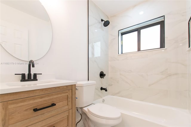 full bathroom featuring vanity, toilet, and tiled shower / bath combo