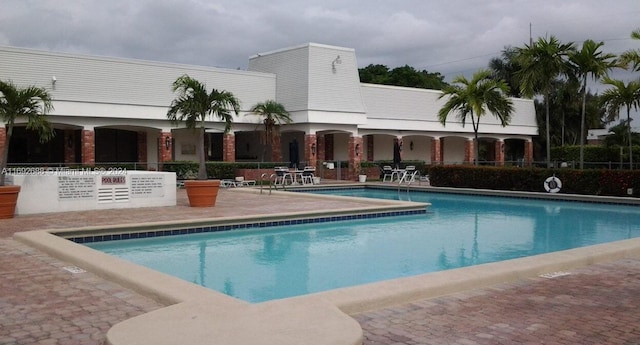 view of swimming pool with a patio