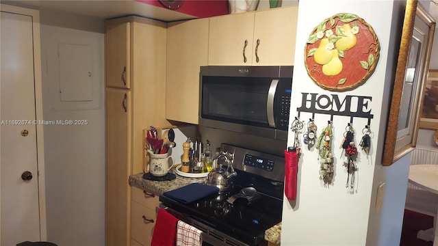 kitchen featuring stone countertops and stainless steel appliances